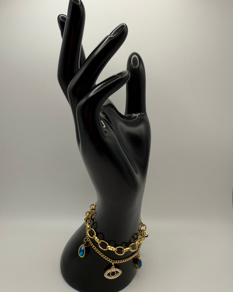 Pulsera con dije de mal de ojo apilado doble