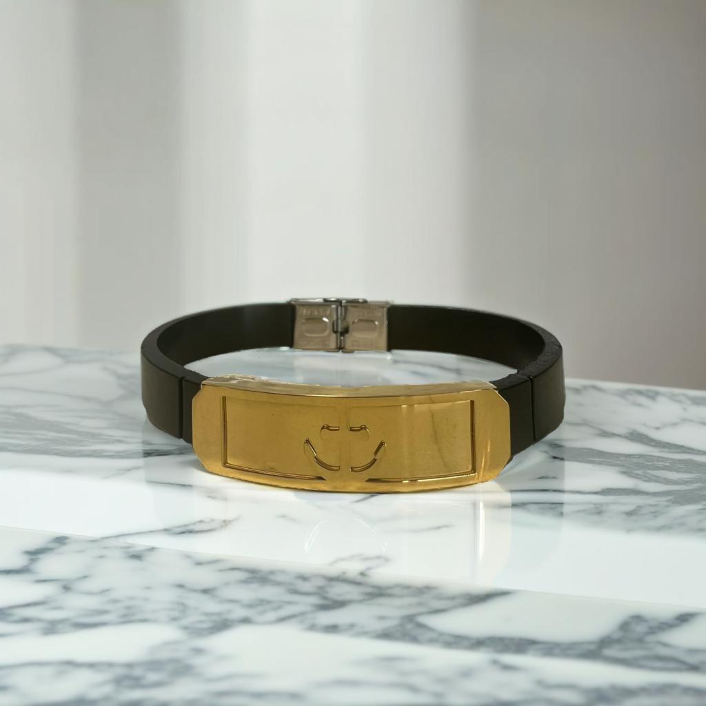 Pulsera de cuero con ancla dorada